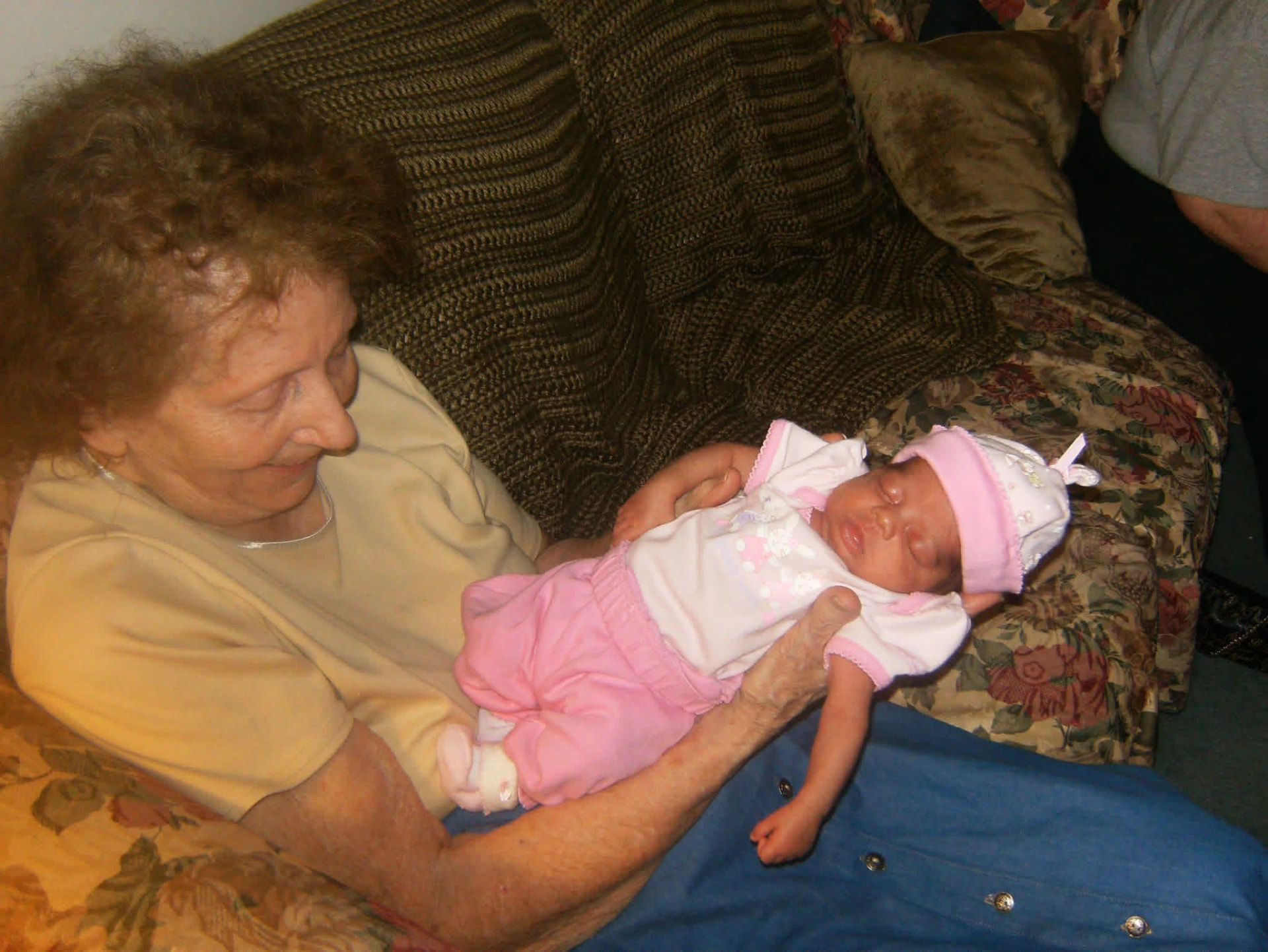 Photo of Trisha's mother holding her great-granddaughter