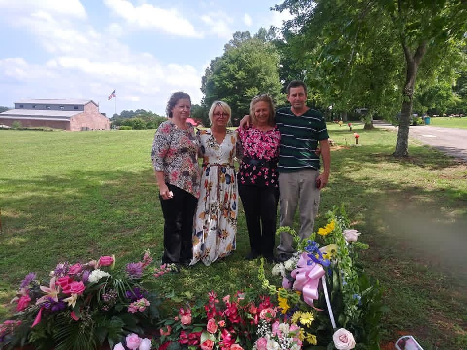 Photo of Trisha with her siblings as adults
